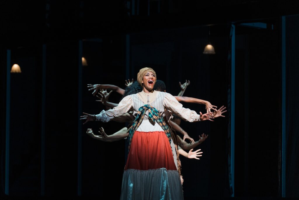 J'Nai Bridges surrounded by Urban Bush Women (Photo by Michael Bishop)