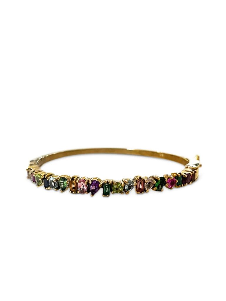 This Multi Gemstone Oval Shaped Bangle from The Woods Fine Jewelry carried at La Vie Style House is the perfect addition to accessorize your look.