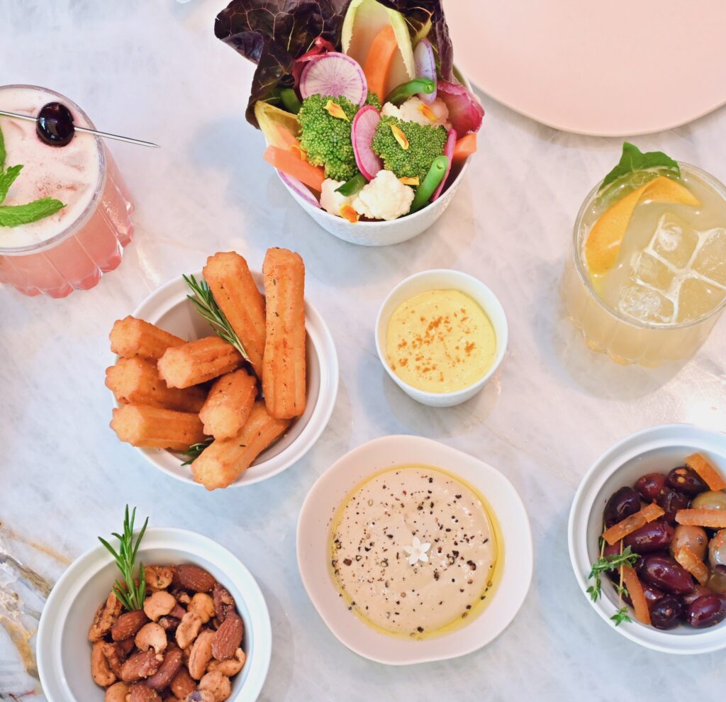 Le Jardinier – Toasted Nuts, Mixed Olives, Garden Crudité, Pommes Dauphines (Photo by Alex Montoya)