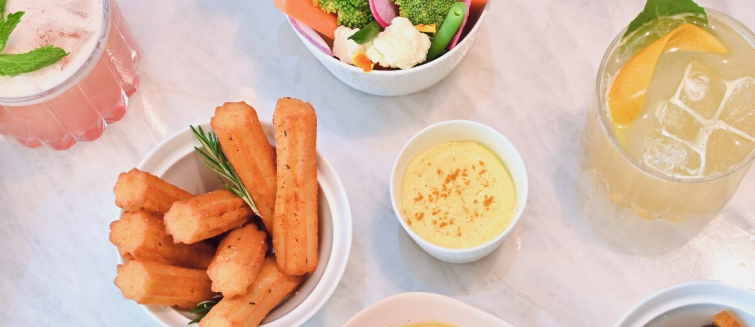 Le Jardinier – Toasted Nuts, Mixed Olives, Garden Crudité, Pommes Dauphines (Photo by Alex Montoya)