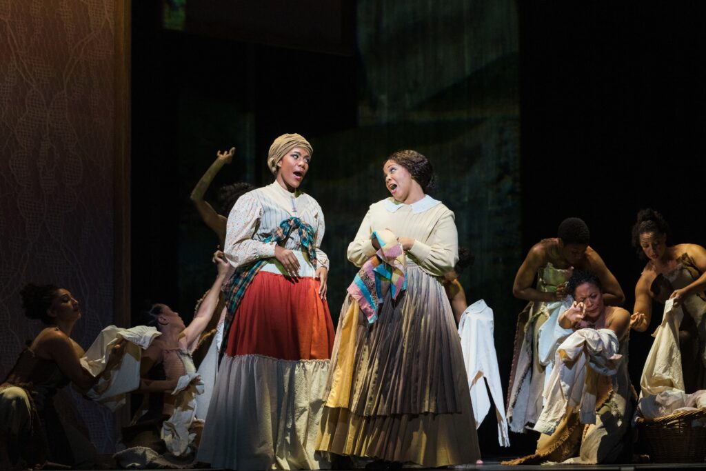 Urban Bush Women dancers surrounding Intelligence stars J'Nai Bridges and Janai Brugger. (Photo by Michael Bishop)