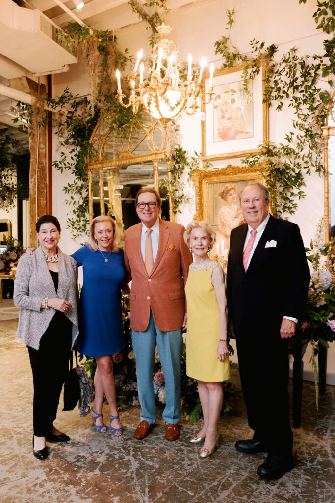 Elizabeth Stribling, French Heritage Society Board chair in yellow, is flanked by members of the society attending the glamorous evening at New Orleans Auction Galleries.