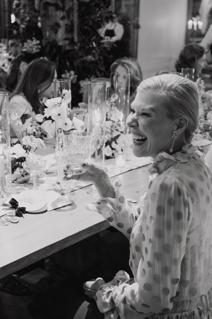 Bettina Bennett of Princeton, New Jersey,  raises a glass during the Versailles-inspired dinner at New Orleans Auction Galleries.