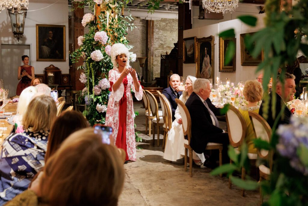 New Orleans native Treshor Webster entertains dinner guests at the NOAG Marie Antoinette-inspired dinner evening. 