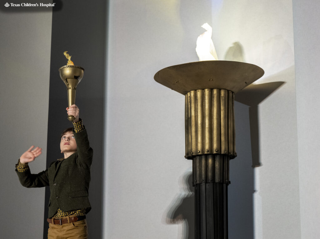 Patient Champion Grayson lights the ceremonial torch at the 12th annual fundraiser for Texas Children's Cancer and Hematology Center.  (Photo by Texas Children's Hospital)