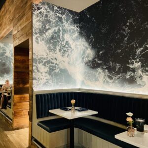 Plank – Sea spray splashes around banquette seating. (Photo by Courtney Dabney)