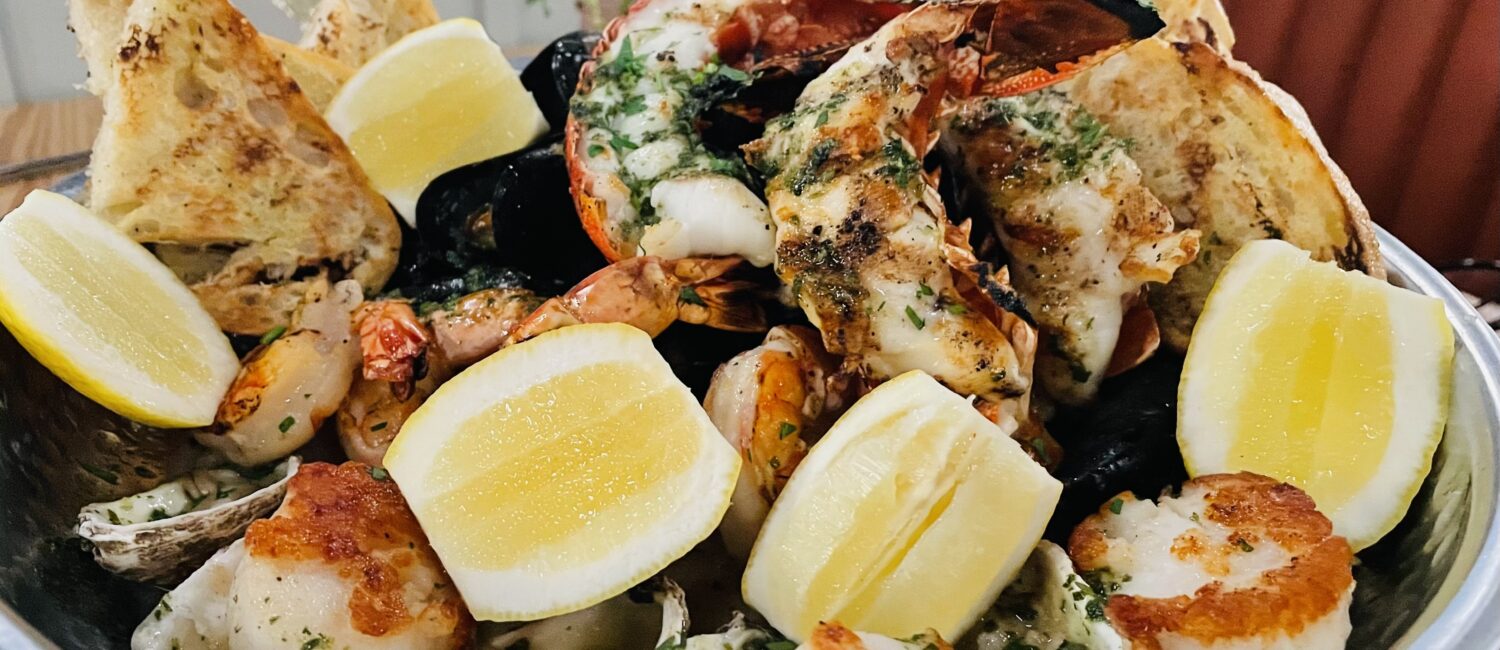 Plank – The grilled seafood tower is a seafood sampler smorgasboard. (Photo by Courtney Dabney)
