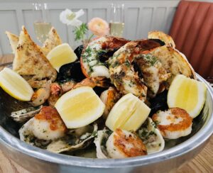Plank – The grilled seafood tower is a seafood sampler smorgasboard. (Photo by Courtney Dabney)