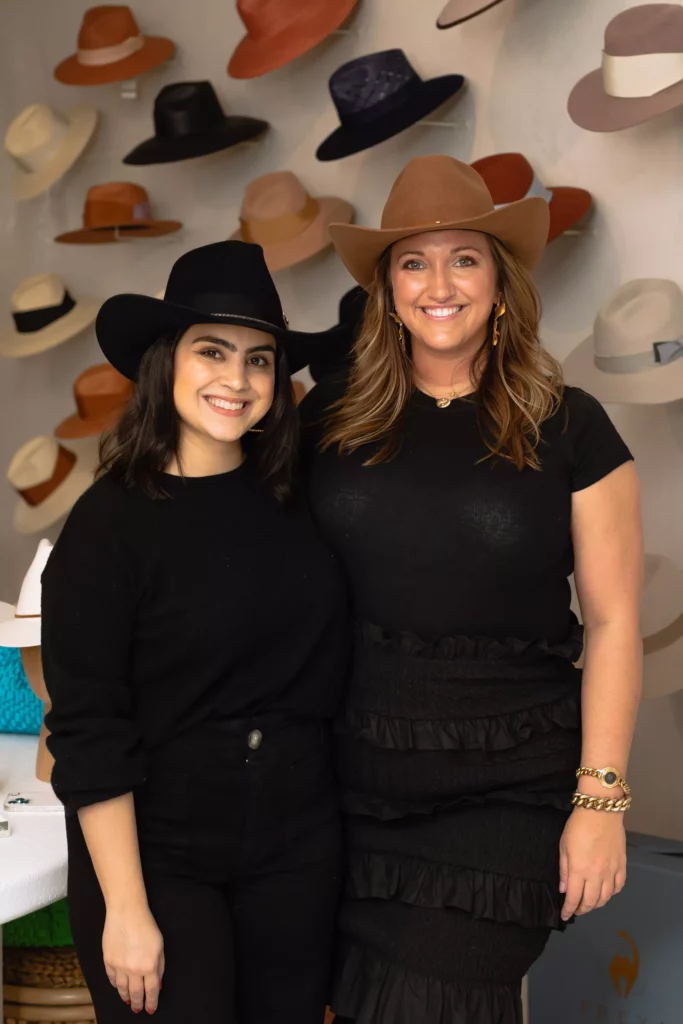 Sarah Wilhelm, Madison Herington at the grand opening fête for Sixteen Ten where Freya hats and Mirth caftans share boutique space. (Photo by Alex Wu)