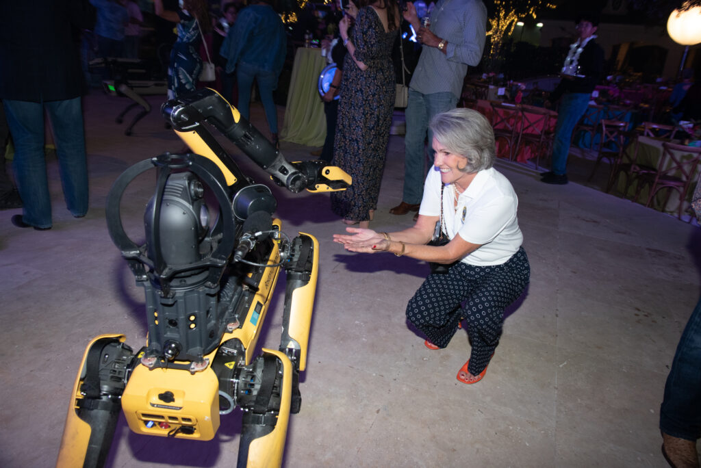 City Council at-large candidate Twila Carter with a Houston Police Department robot at the Houston Police Foundation's 'True Blue' gala.  (Photo by Alexander's Fine Portrait Design) 