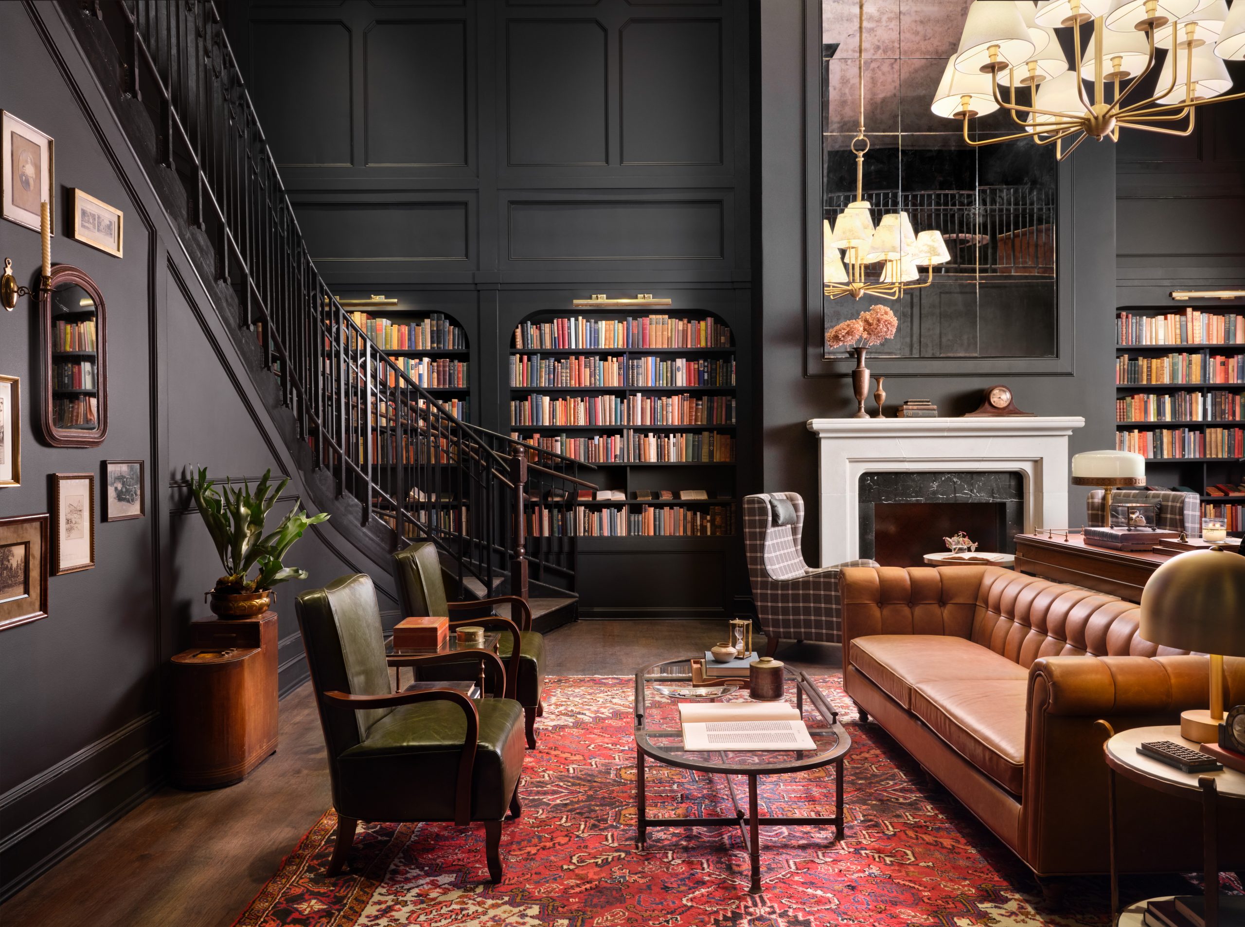 The library has a double sided staircase to the second level at Hotel 1928.