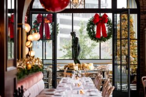 Separating the main dining area from the robin’s-egg blue Versailles room at Annabelle Brasserie, is one of two aged-looking brick archways. (Photo by Kristen Gilliam)