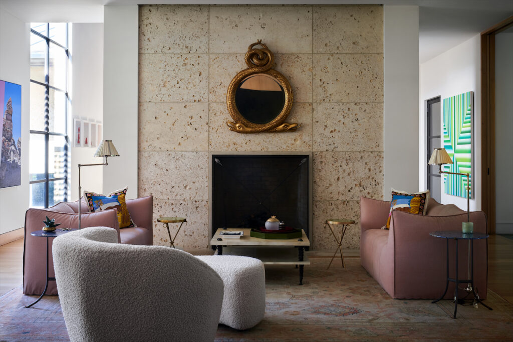 In the salon, a gilt Serpentine mirror by Rose Tarlow. Vladimir Kagan swivel chair. B&B Italia sofas, David Iatesta floor lamps. Coffee table is a Paris flea-market find. Abrash rug. Bronze side tables by Cedric Hartman. Martini tables from The Lacquer Company. (Photo by Pär Bengtsson)