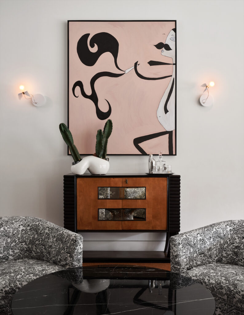 In the back house are an Italian mid-century bar designed by Vittorio Dassi, B&B Italia chairs, Knoll coffee table, and Ingo Maurer sconces. (Photo by Pär Bengtsson)