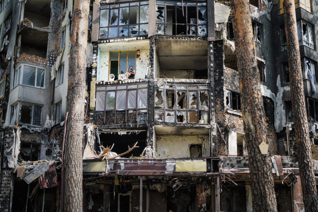 Russian military forces launched artillery and air attacks on residential buildings in Irpin, resulting in significant damage and destruction. Approximately 70% of the buildings in the area were affected. A resident of Irpin is seen rebuilding his apartment in a destroyed building. Irpin, Ukraine. July 2022. (Photo by Alena Grom. Courtesy Ukrainian Association of Professional Photographers.) 