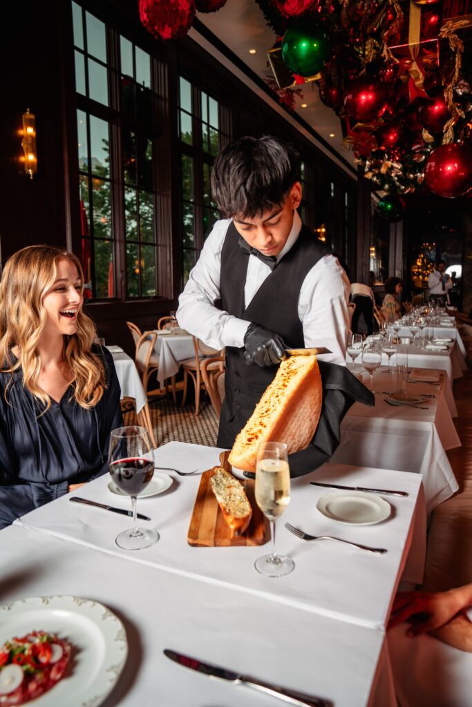 Dining after dark at Annabelle Brasserie,  the can’t-miss baguette with raclette ($16) helps make any meal memorable.  (Photo by Brian Kennedy)