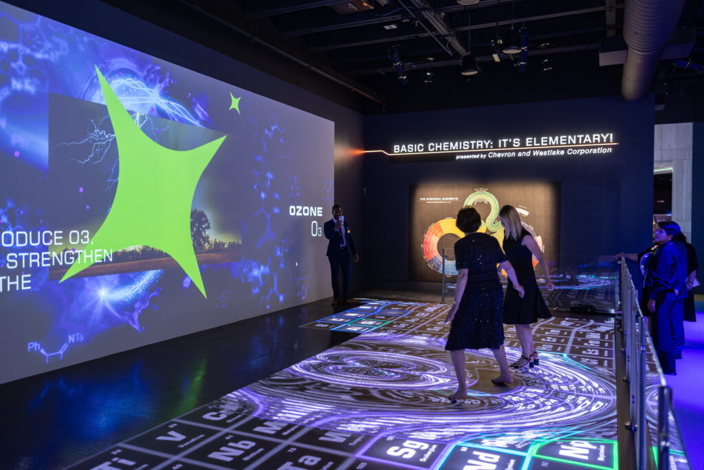 Bobbie Nau, Anne Hamman Brollier dancing on the Periodic Table of the Elements at HMNS' preview of the re-imagined Welch Hall: Matter & Motion (Photo by Mike Rathke, HMNS Photographer)