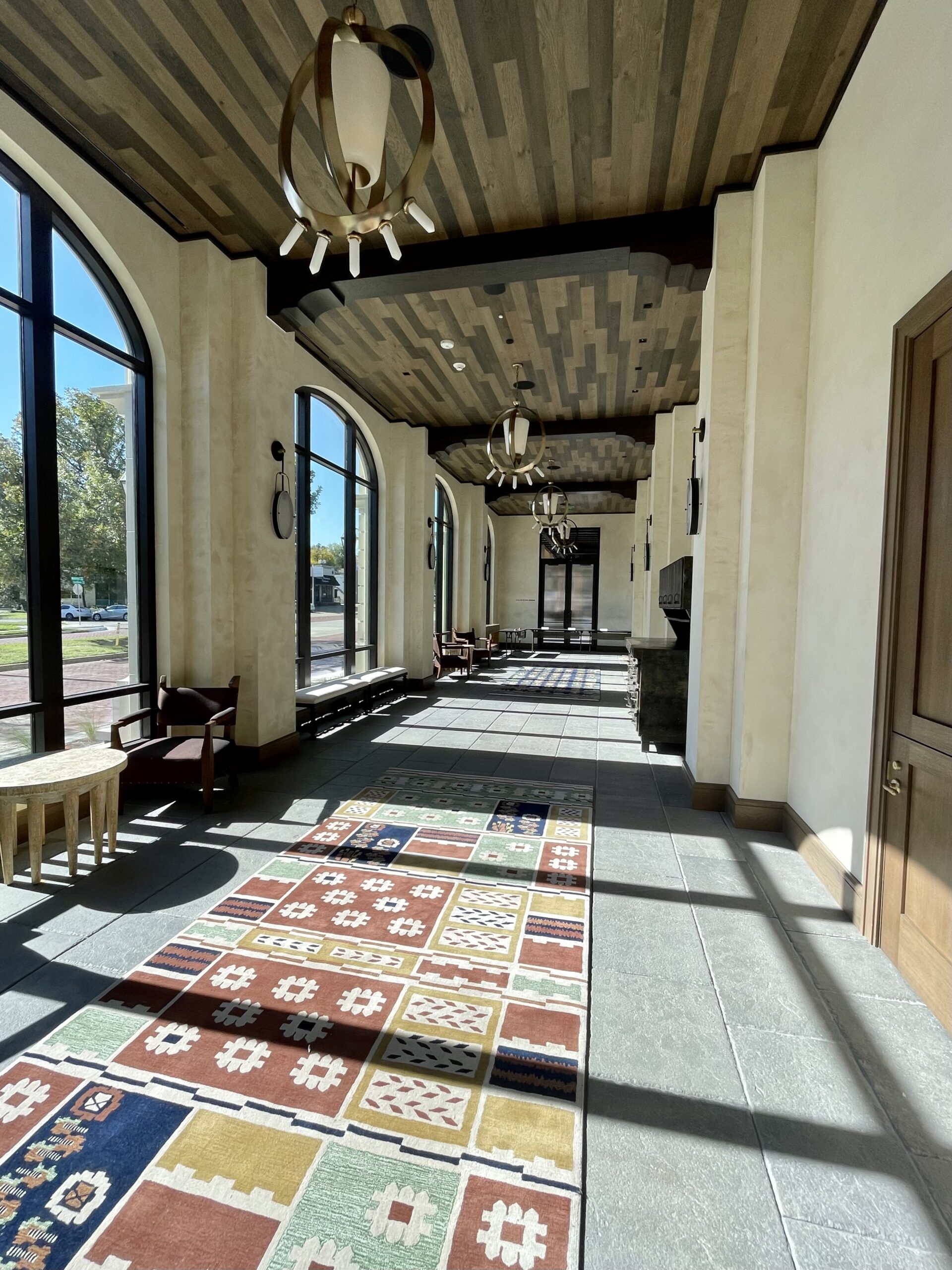 A sunny stroll down the Arcade pre-function space at Bowie House is light filled. (Photo by Courtney Dabney)