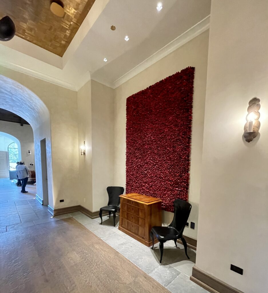 Matte Venetian plaster arches and coppy ceiling treatment in the lobby. (Photo by Courtney Dabney)