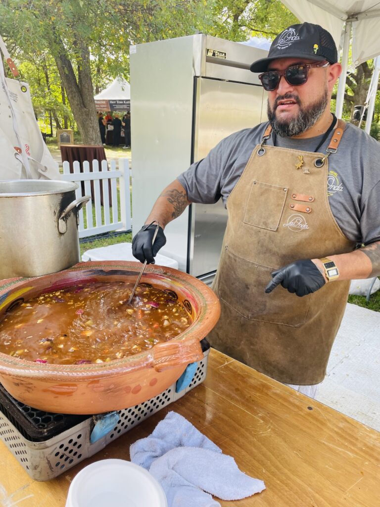 Chef Victor Villarreal of Fort Worth's La Onda literally stirs the pot at Chefs for Famers. (Photo by Courtney Dabney)