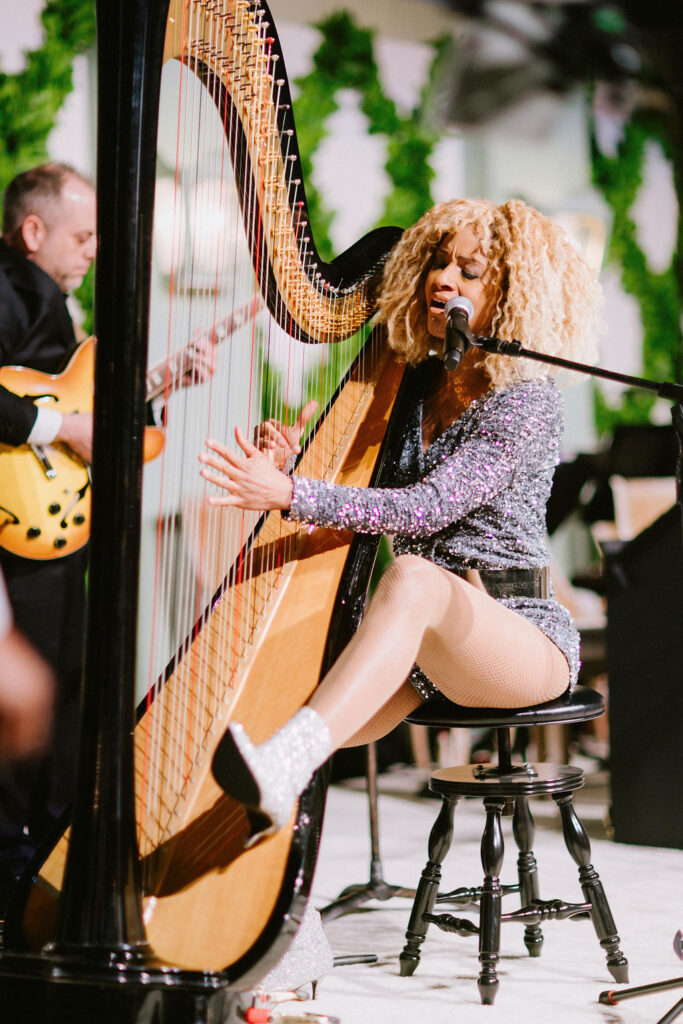 Tulani on the harp at Children's Memorial Hermann Hospital 'Fare La Fête' gala in Memorial Park. (Photo by Joseph West)