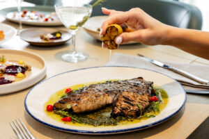 Emelia’s – Roasted artic char is a show stopper by chef Preston Paine at Emelia’s.