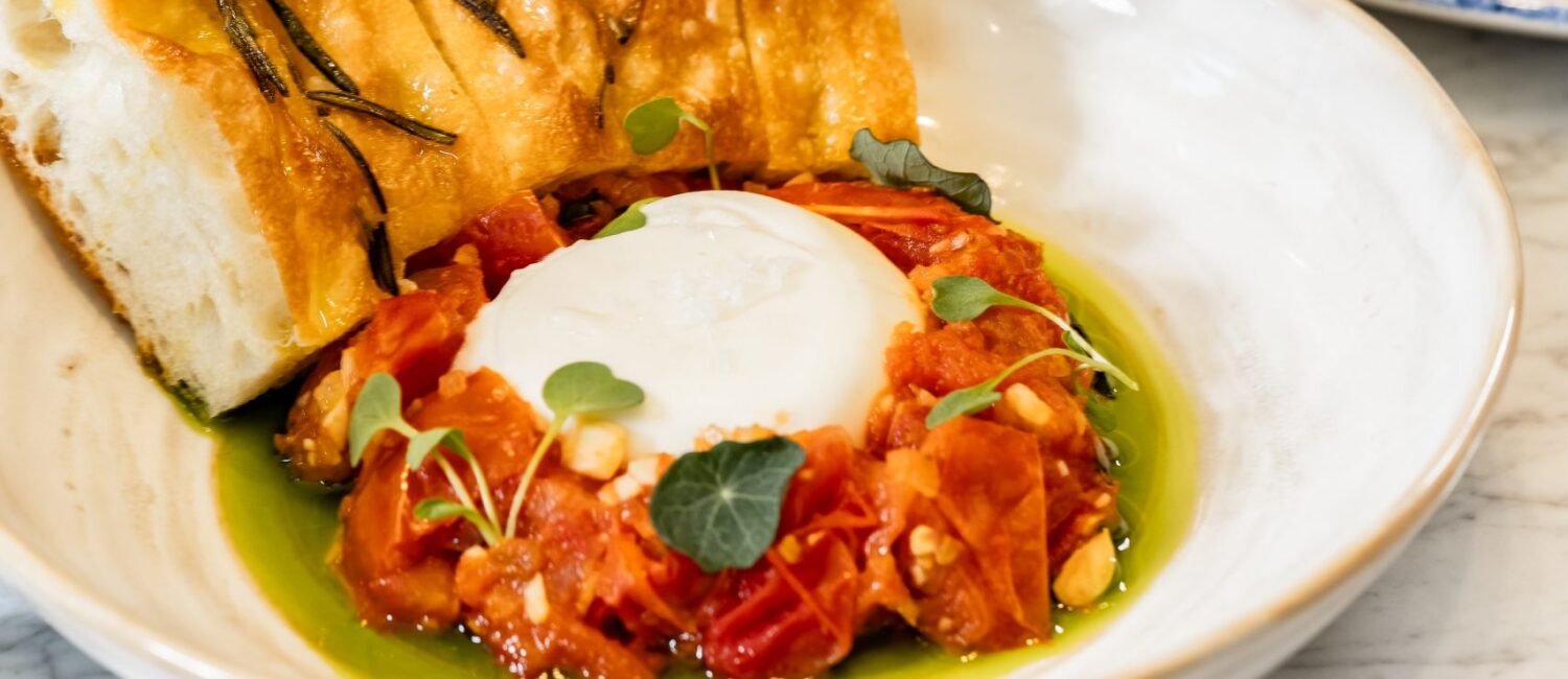 Emelia’s – Starters include burrata with roasted tomato jam and a carpaccio trio of tuna, salmon and scallops.