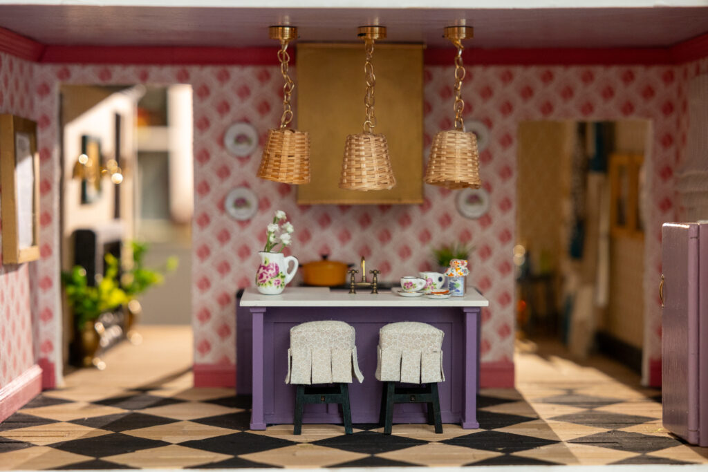 A miniature kitchen in the dollhouse designed by Emily Spanos of Emily June Designs (Photo by Jenny Antill Clifton)