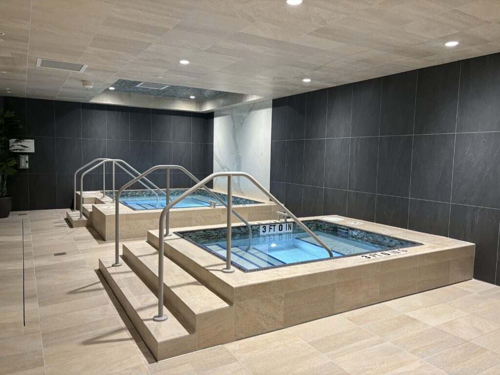 Cold plunge and sauna experiences are available in men's and women's locker room areas.