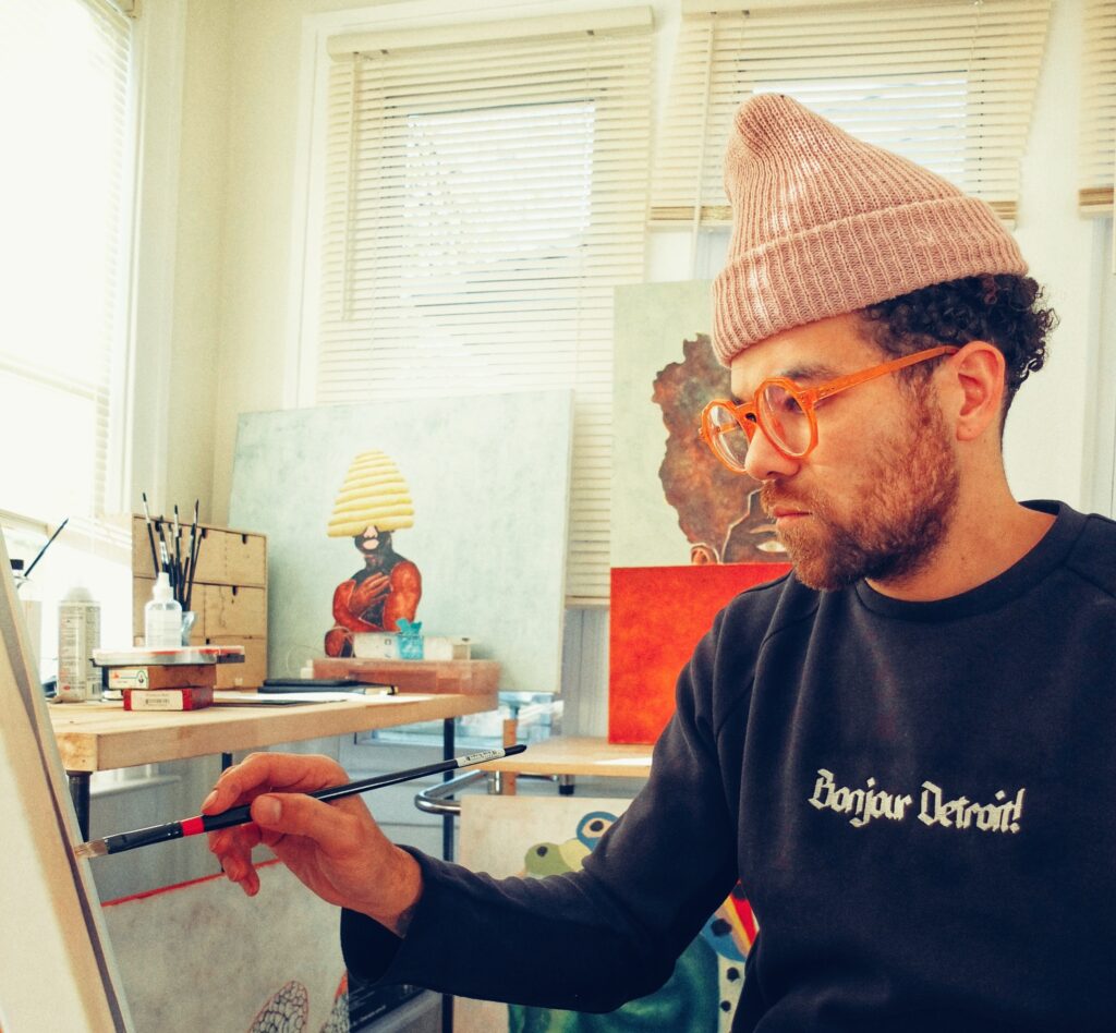 Artist Johnny Floyd, who is from Detroit, Michigan, works in his studio. Floyd's "GODBODY" exhibit remains on view through Saturday, November 18 at the Houston Museum of African American Culture. (Courtesy Johnny Floyd)