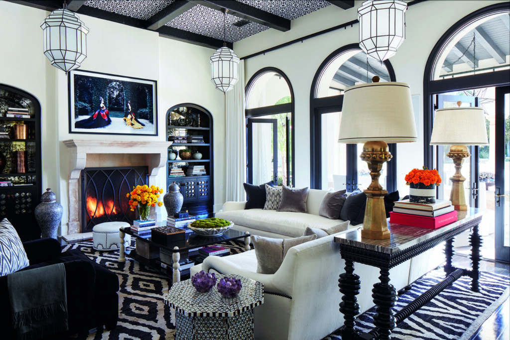 In Khloe Kardashian's family room, a Patrick Demarchelier artwork raises to reveal a television; fireplace is French 18th century.  (Photo by Douglas Friedman)