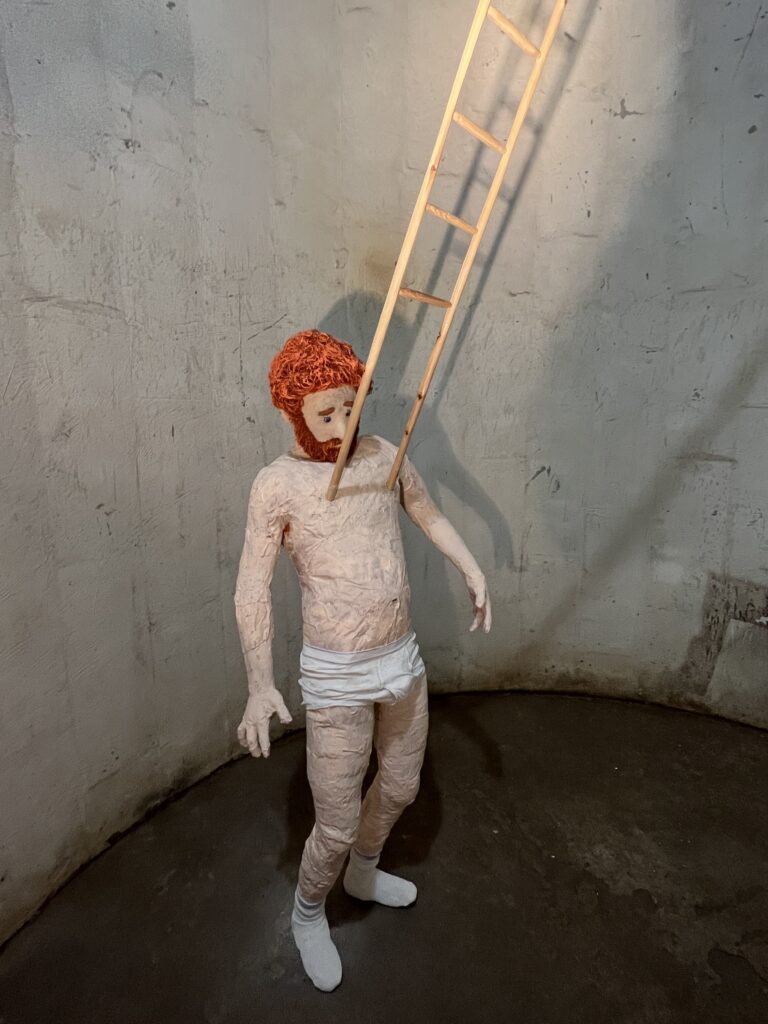 Dallas provocateur Jeff Gibbons' "Ladder Nipples (Nipocchio)" serves up a wry self-portrait at The Silos at Sawyer Yards where it dialogues with the Site Gallery's industrial relic the former Success Rice silos. (Photo CDA)