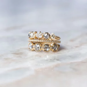 Jewels 2023 – Megan Thorne ring topper in ribbed rose cut salt and pepper diamonds with claw mounts are beyond unique