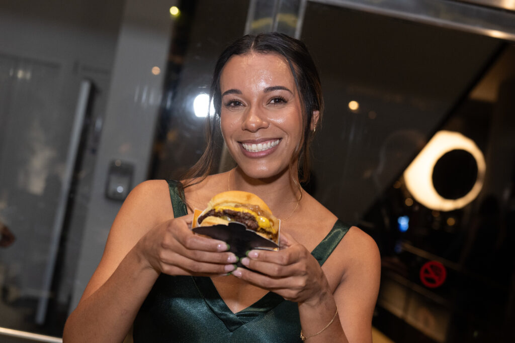 Laura Stokes with a Bun B Trill Burger at the Museum of Fine Arts, Houston Grand Gala Ball (Photo by Wilson Parish)