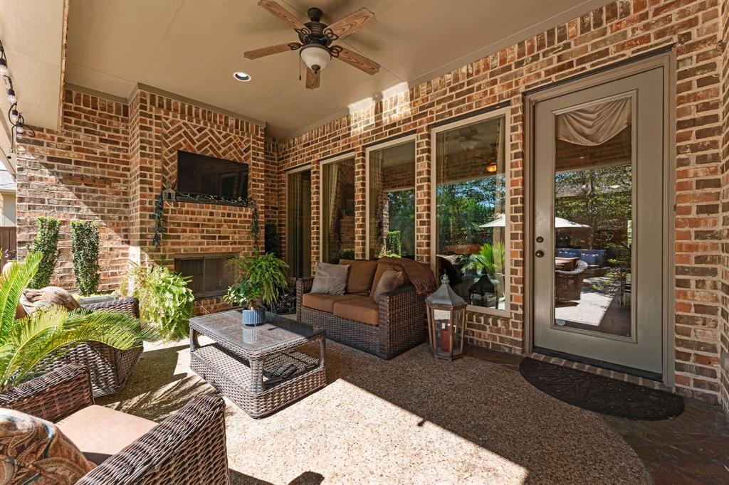 The backyard oasis includes an outdoor kitchen, TV area, bar and several sun lounging spots. 