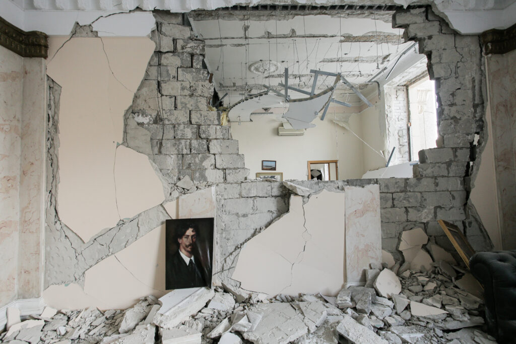A building destroyed by missile strikes in the center of Kharkiv, Ukraine. March 16, 2022. (Photo by Pavlo Dorogoy. Courtesy Ukrainian Association of Professional Photographers.)