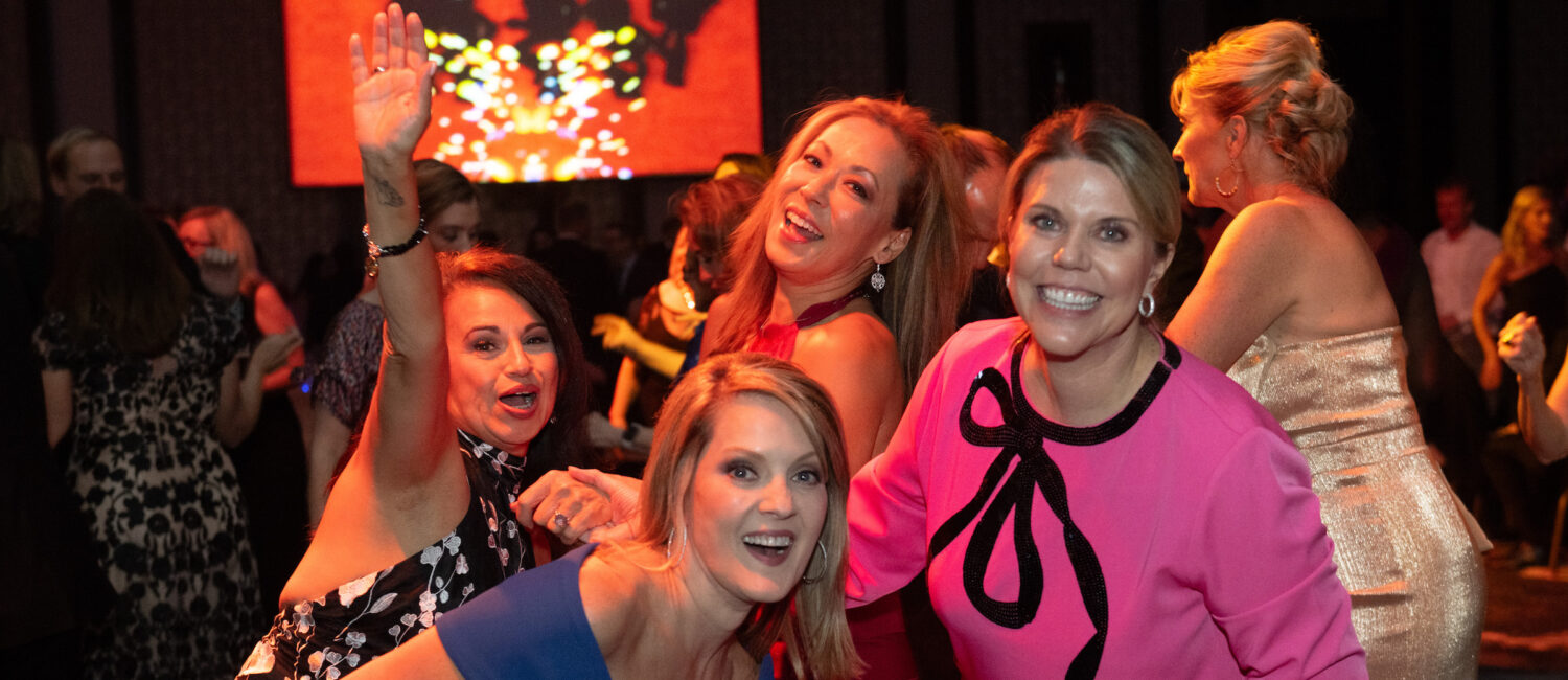erri Ebel, Molly Bobrow, Pat Mitchell, Claudia Kreisle dancing to the sounds of Skyrocket at the British American Foundation of Texas gala (Photo by Wilson Parish)