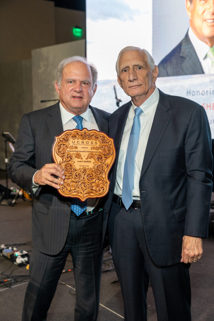 Scott Sheffield receives the Raymond Plank Award for Visionary Leadership from Steve Farris at the 40th anniversary dinner celebrating Ucross.  (Photo by Jenny Antill)