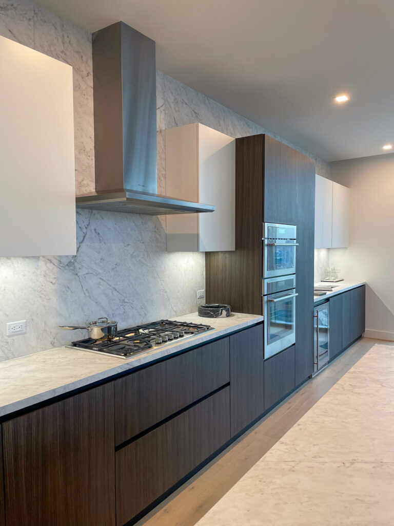 The kitchen of The Dunlavy floor plan in Residences at The Allen on tour at the luxe property's grand opening.  (Photography by Robert Taylor V)