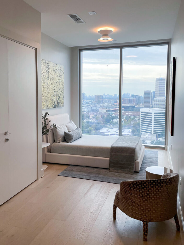 A secondary bedroom in The Dunlavy floor plan in Residences at The Allen on tour at the luxe property's grand opening.  (Photography by Robert Taylor V)