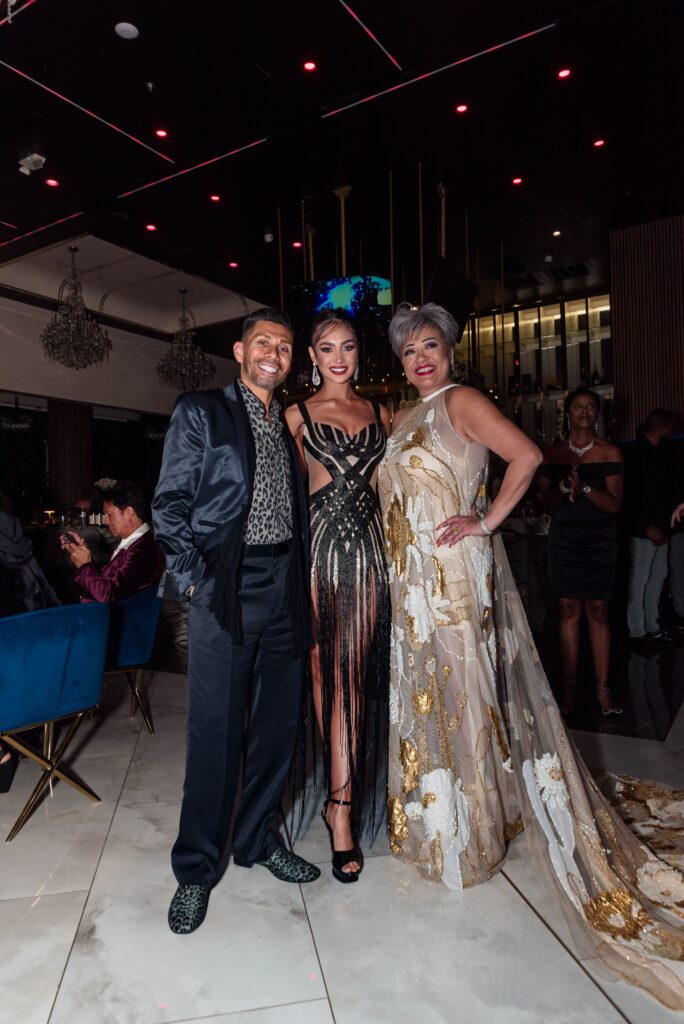 Antonio Contreras, Miss Universe 2022 R'Bonney Gabriel, Rosalina Lydster at the 50th anniversary celebration of the fashion Battle of Versailles. (Photo by Torry Sledge)