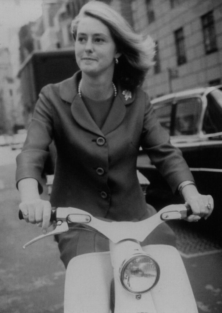 Mary Ella Gabler riding her Honda 50 motor scooter in Manhattan, 1964.
