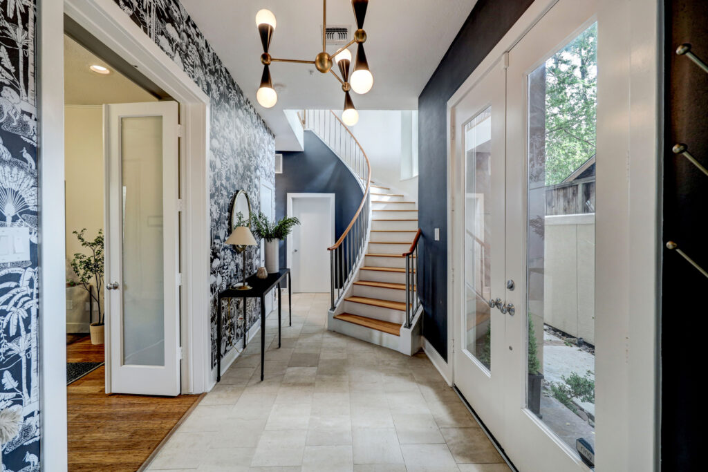 4419 Mandell Street's luxurious floors are connected by a reclaimed, hardwood spiral staircase.