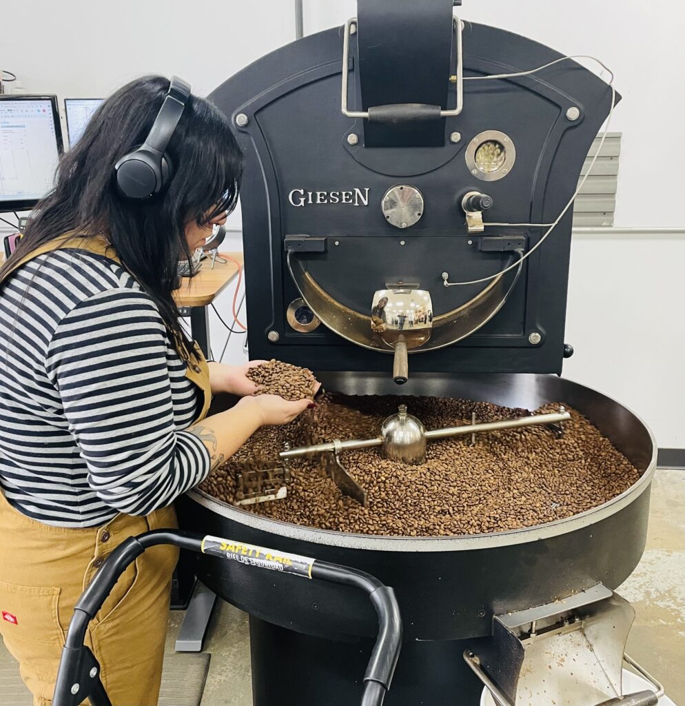 Head Roaster Marisa Zapata checks the beans during one roasting session at Cherry Coffee. (Photo by Courtney Dabney)
