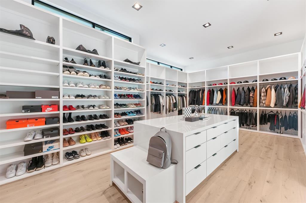 This closet is a dream space for anyone with an overflowing shoe or bag collection.