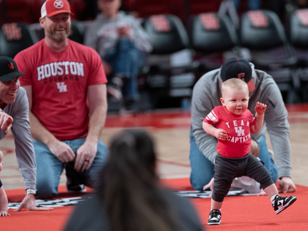 Baby races became the latest bit of halftime fun at the Fertitta Center. (Photo by F. Carter Smith)