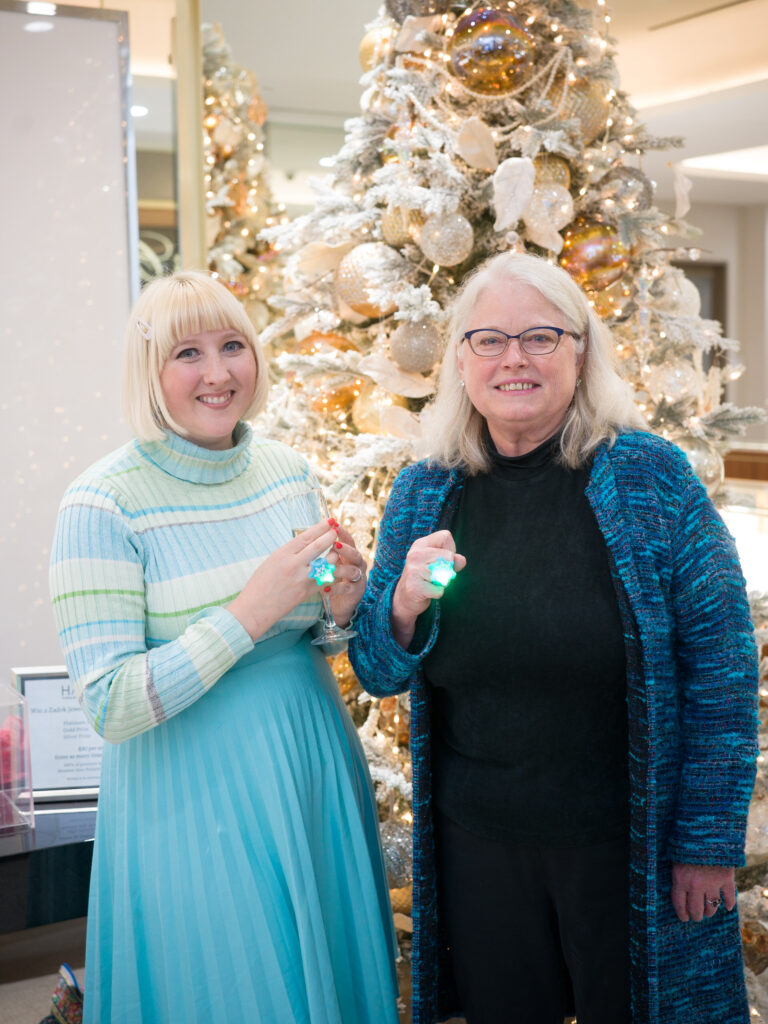 Darenda Dorsey, Laura Widing with HAWC at the Zadok holiday party (Photo by Daniel Ortiz)