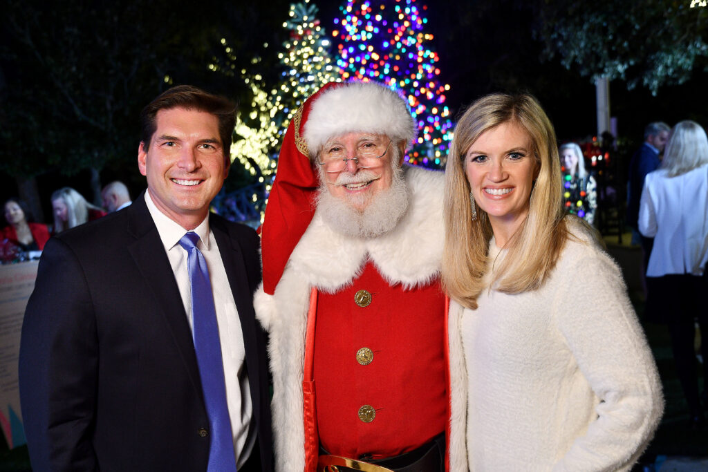 David & Nicole Durham with Santa  at the MD Anderson Children's Cancer Hospital Santa's Elves fundraiser at the Fertitta family home.