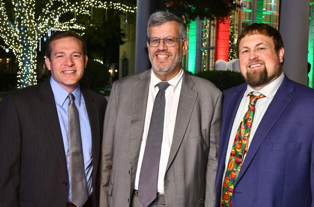 Dr. Gregory Friedman, Dr. Richard Gorlick, Aaron Walton at the annual Santa's Elves party benefiting MD Anderson Children's Cancer Hospital