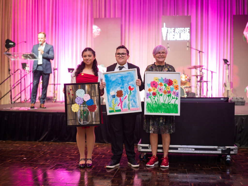 Dr. Lauren Langford and The Sunshine Kids display their work at the Arts of Healing Foundation Physician Art Show and Dinner at the Post Oak Hotel (Photo by Daniel Ortiz)